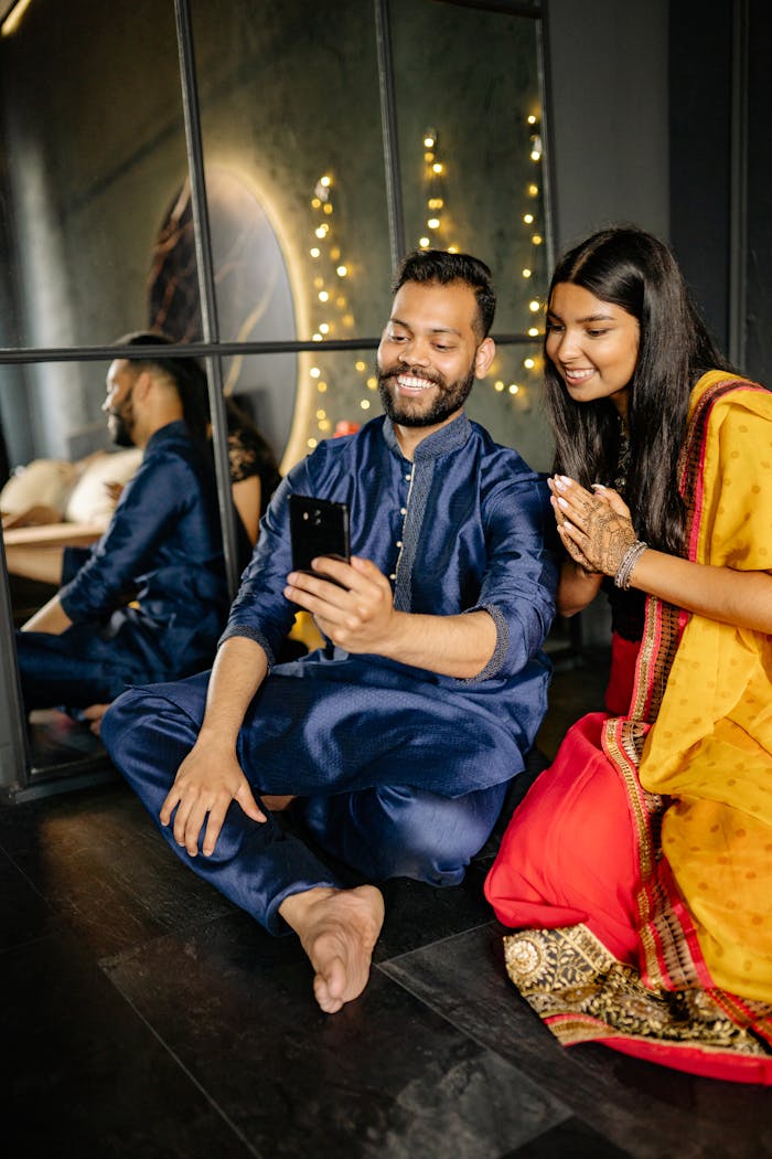 Father and daughter in traditional attire enjoy bonding time during Diwali.