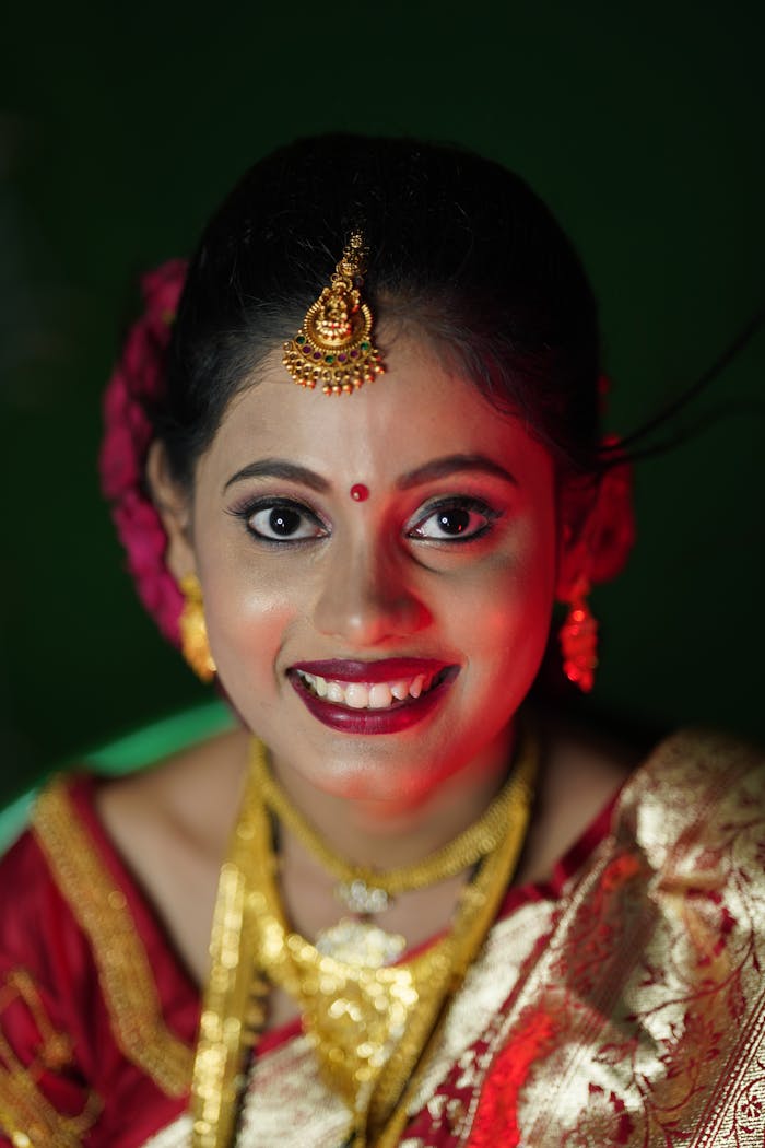 Stunning portrait of an Indian bride adorned in traditional attire with a captivating smile.